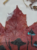 Whispers of the Autumn Grove Painting on Maple Leaf