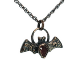 Tiny Copper Embossed Bat Pendant with Faceted Garnet
